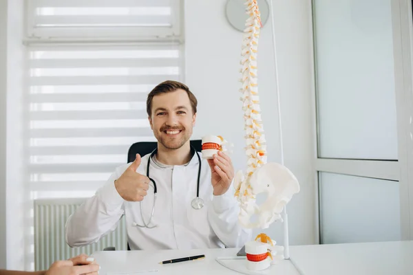 stock image Portrait of male doctor physiotherapist in her workplace at hospital