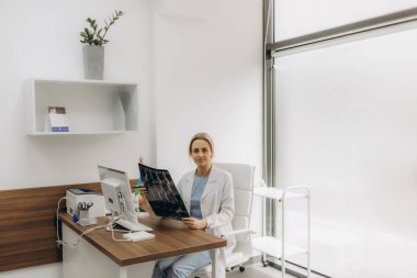 MRI digital x-ray of brain with radiologist doctor oncology working in clinic hospital. Medical healthcare concept. Medical experts studies the EEG condition of the patient. Doctors Examining X-Ray