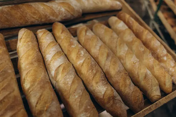 stock image Multiple trays of baguettes fresh out of the oven at a commercial bakery in French Polynesia