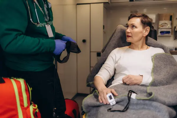 stock image A woman's blood sugar is measured in an ambulance