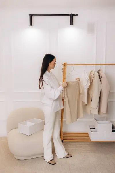 stock image A female fashion designer puts together clothes