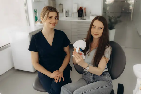 stock image female dentist communicates with a patient in dentistry