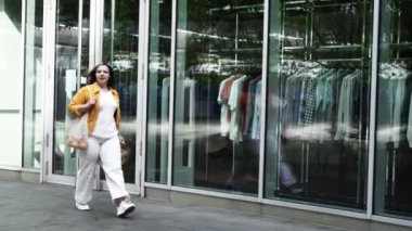Happy curvy woman with ecologic craft shopping bags enjoying in shopping. Consumerism, shopping, lifestyle concept