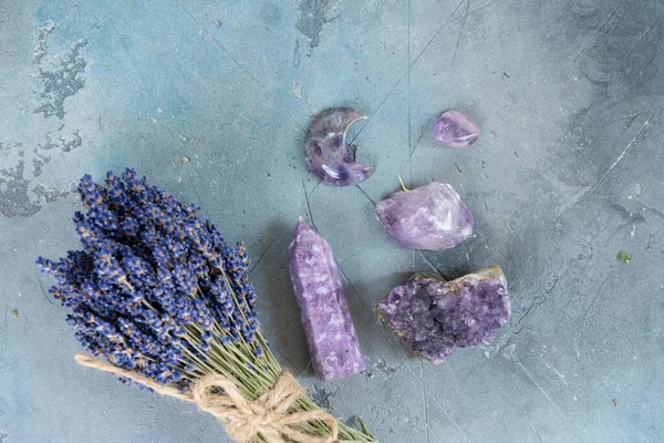 Gemstones minerals stones and obelisks with dry lavender flowers close up. Witchcraft, herbal medicine and healing, Magic healing Rock for Reiki Crystal Ritual, Witchcraft, spiritual esoteric practice