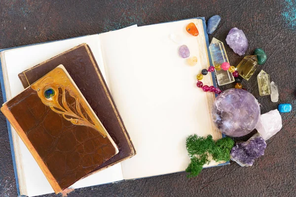 Empty book with copy space with gemstones set for relax and meditation. Magic ball and minerals for Reiki life balance, healing Crystal Ritual, Witchcraft, spiritual esoteric practice.