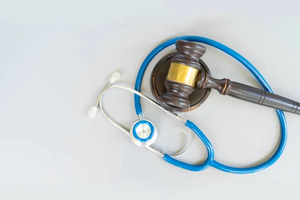 law gavel, stethoscope close up, medical law concept