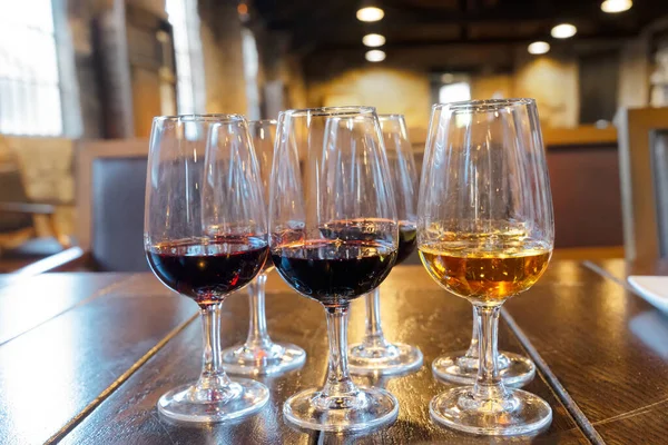 port wine testing, glasses with drink samples in bar