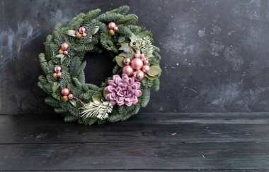 Cristmas wreath garland decorations over dark background