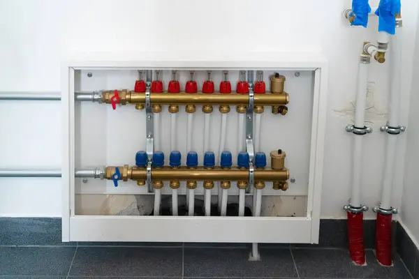 Distributor of central heating. Pipes on Central Heating Distributor in private house