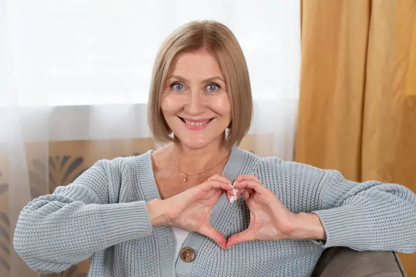 Blond Senior Woman Relaxing Woman Heart Made Hands Happy Retirement Stock Picture