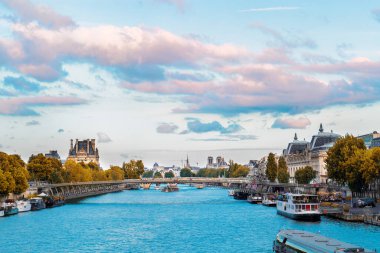 Pris cityscape with Notre Dam spires, Orsay museum, Louvre, passerelle Leopold Senghorl and river Siene at summer, Paris, France clipart