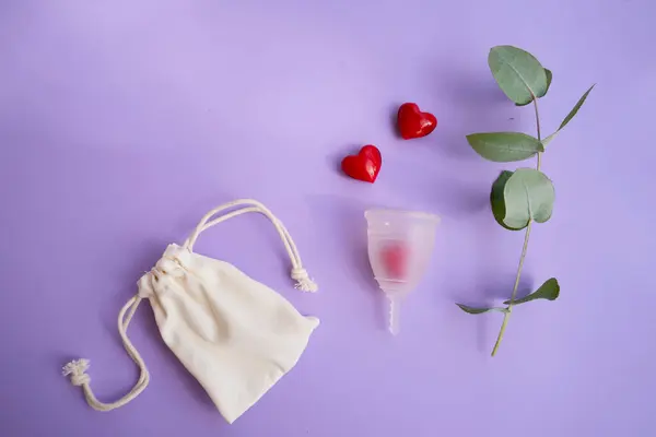 stock image Menstrual cup over violet background, eco friendly and zero waste solution