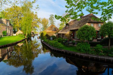 rural dutch traditional country small old town Giethoorn with canals, Netherlands clipart