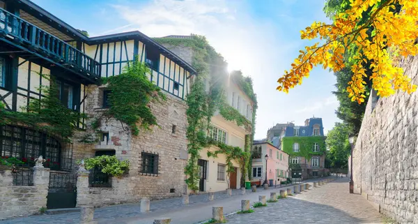 stock image View of historical street in quarter Montmartre in Paris, France. Cozy cityscape of Paris with Sacre Coeur church. Architecture and landmarks of Paris