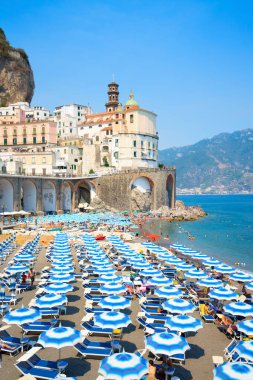 Amalfi town and summer Atrani beach with umbrellas , Italy, retro toned clipart