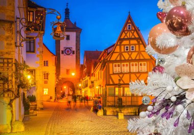 illuminated night street in Rothenburg ob der Tauber, Germany, retro toned clipart