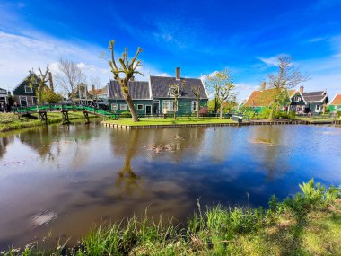 rural dutch country skyline of small old town Zaanse Schans at sunset, Netherlands at spring clipart