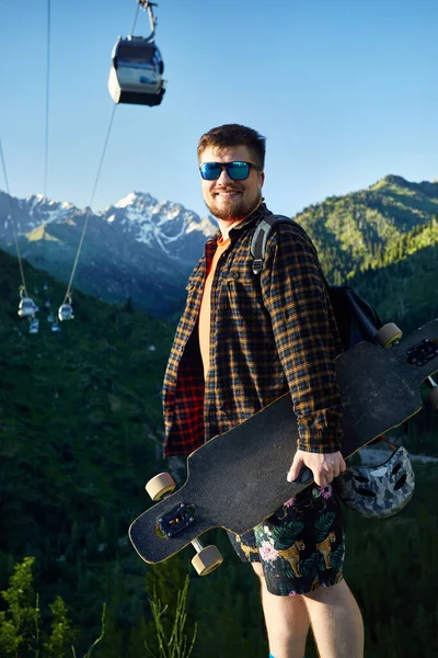 Portrait Bearded Man Skater Sunglasses Holding His Longboard Mountain Road — Stock Photo, Image