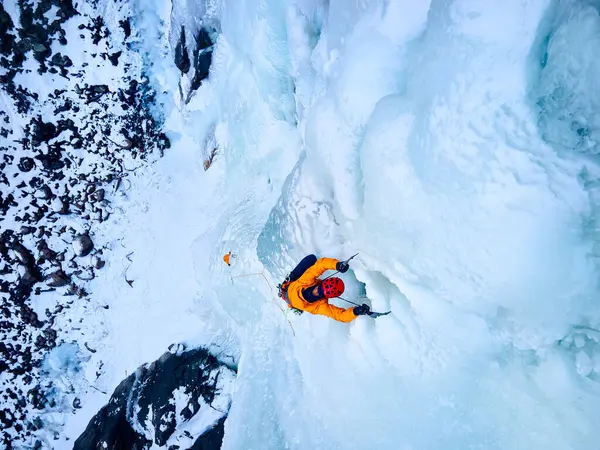 Aerial Drone View Athlete Orange Jacket Ice Climbing Big Frozen Stock Picture