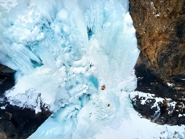 Aerial Drone View Athlete Ice Climbing Big Frozen Waterfall Barskoon Royalty Free Stock Images