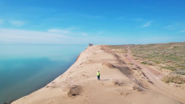 Aerial Drone Shot Woman Walking Sand Desert Dune Blur Sea Royalty Free Stock Video