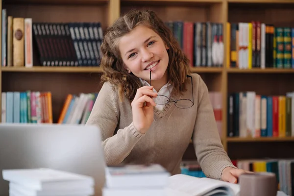 Attractive Happy Young Girl Student Studying College Library Sitting Desk — Foto de Stock
