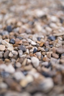 Boulder pebble beach stones background seamless texture for design use. Naturally rounded gravel at river. Nature background texture pattern
