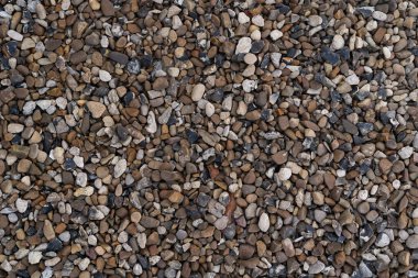 Boulder pebble beach stones background seamless texture for design use. Naturally rounded gravel at river. Nature background texture pattern