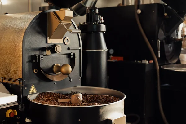 Stock image Professional machine in process of roasting and mixing coffee beans in modern industrial factory