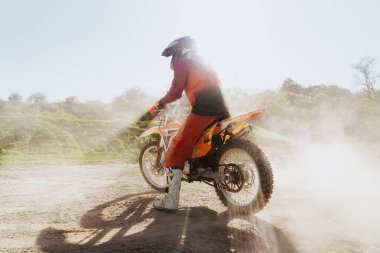 Man riding motorbike on motocross track.Extreme and Adrenaline. Motocross rider in action. Motocross sport. Active lifestyle