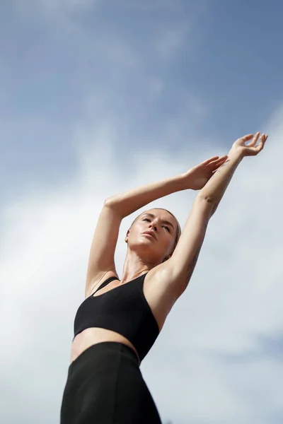 Blonde Fitness Model Black Sportswear Stretching Her Arms Sky She — Stock Photo, Image