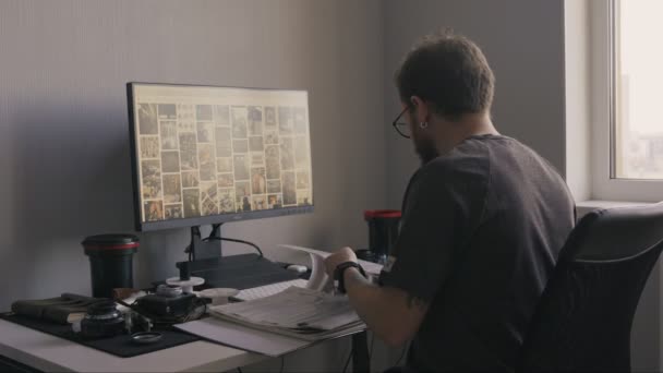 Photographer Examines Film Negatives Window Using Natural Light Reveal Hidden — Stock Video