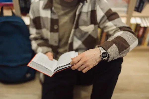 Warmly Lit Library Young Man Stylish Sweater Deeply Focused Reading Royalty Free Stock Photos