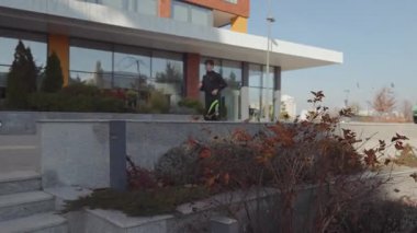 Young athlete training outdoors, descending a flight of urban stairs, promoting fitness and wellbeing through movement.