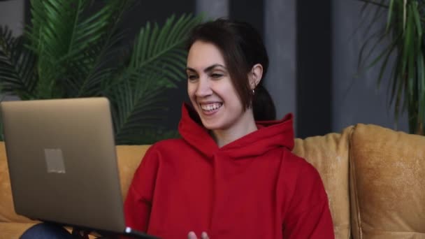 Happy Young Woman Sits Living Room Laptop Talks Online Remotely — Stock Video