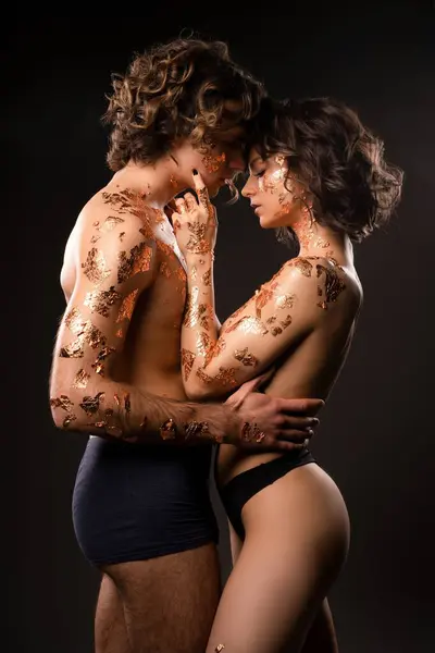 Side View Sensual Loving Couple Underwear Wavy Dark Hair Golden Стокове Зображення