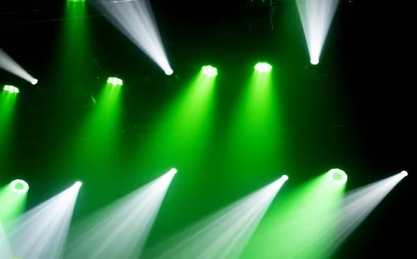 Light of stage with green and white spotlights projectors