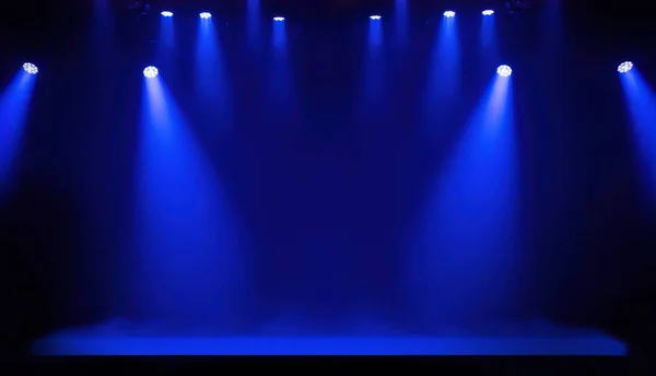 Light on a free stage, scene with blue spotlights on a background