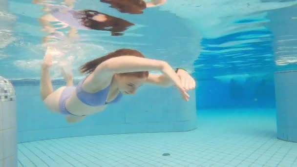 Cute Little Girl Swimming Underwater Pool — Stock Video