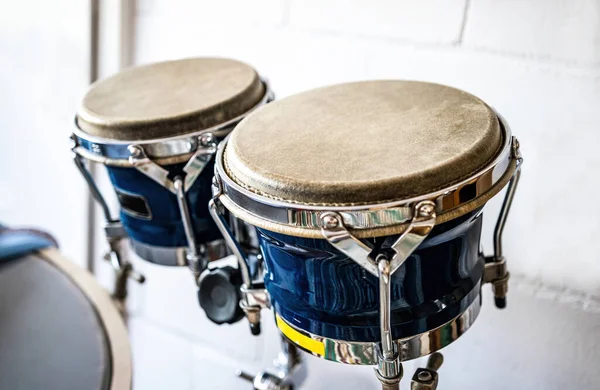 Blue bongos drums in recording studio for hard beat perfomance. Professional musical instrument for rock concerts