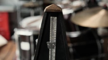 Mechanical metronome for music rhythm and tact measuring in motion with sound. Classical tool for musicians and song creators