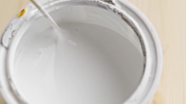 Worker Stirs White Paint Stick Tray Preparing Home Renovation — Vídeo de Stock