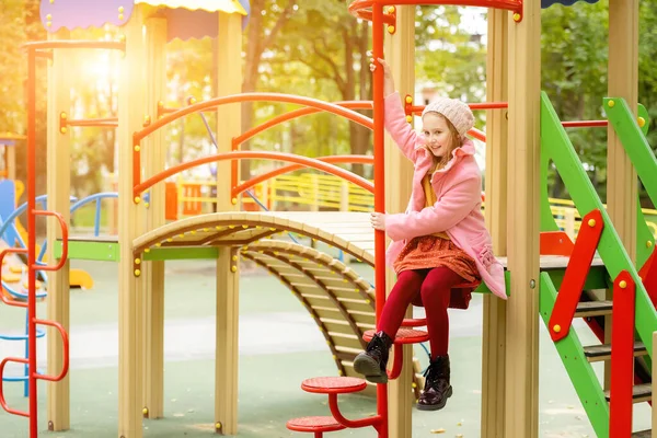 Pretty Girl Kid Sitting Playground Autumn Day Outdoors Smiling Female — Zdjęcie stockowe