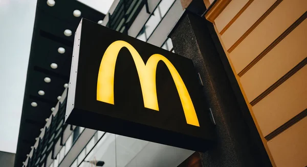 stock image Belin, Germany - 20 December 2022: McDonalds symbol on a board in the city street