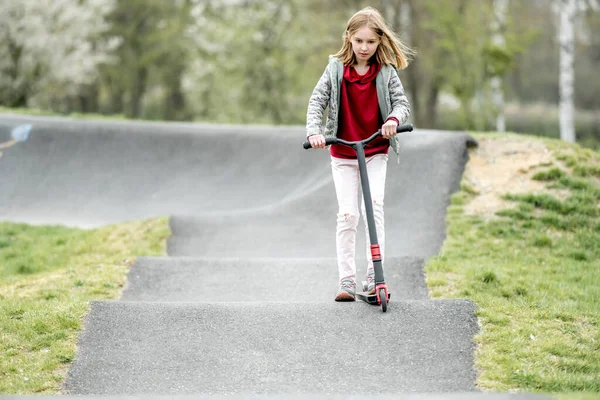 Beautiful Little Girl Rides Scooter Extreme Ride Park — Stockfoto