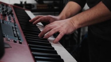 Man hands playing piano keyboard, music with passion closeup. Musician perfomance with classical music on pianoforte