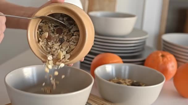 Girl Puts Oatmeal Nuts Fruits Jar Bowl Plate Delicious Cereal — Vídeo de stock
