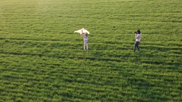 Pretty Woman Shooting Cute Little Girl Kite Field Sunset — Stock Video