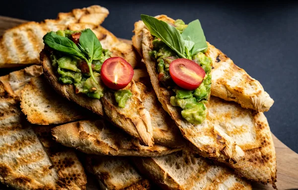 Bruschettas French Toasts Guacamole Basil Cherry Tomatoes Wooden Board Mexican — Stock Photo, Image