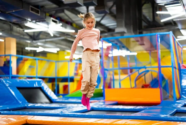 Pretty Girl Kid Jumping Colorful Trampoline Playground Park Smiling Caucasian — Stock Photo, Image